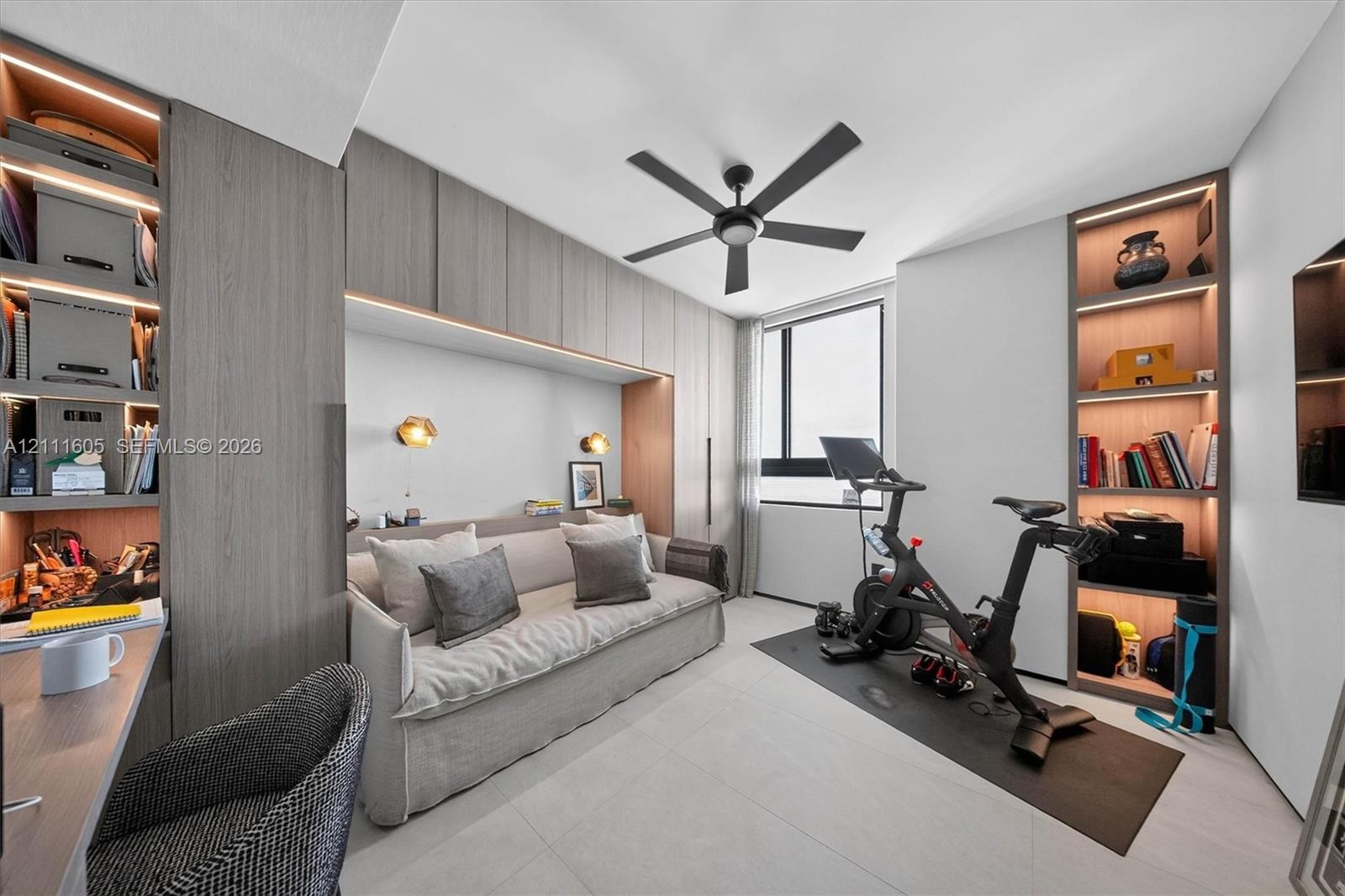Private balcony featuring horizontal metal railings and sliding glass doors