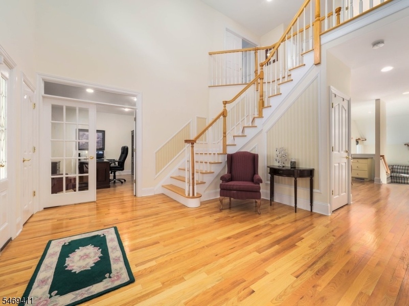 Grand foyer with custom stairs