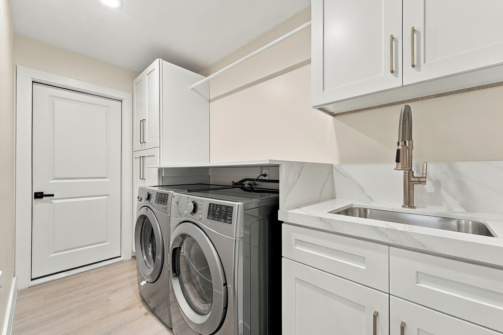 Brand new GE washer and dryer and custom cabinets to make this laundry room ideal