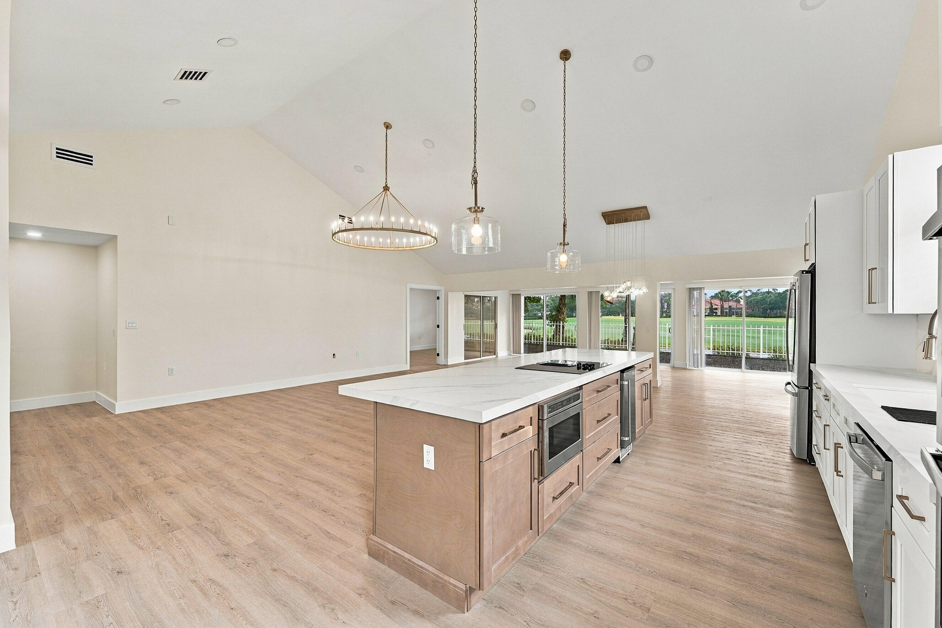 Custom chef's kitchen with brand new GE appliances and beautiful gold accents throughout
