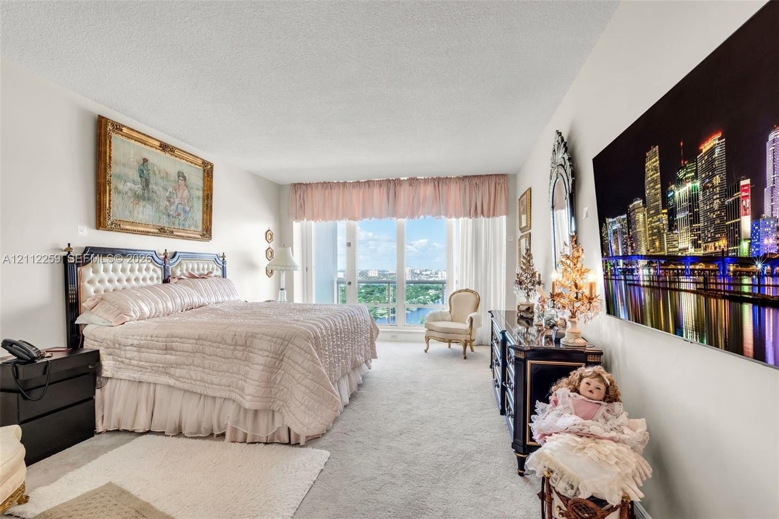 Floor-to-ceiling windows with balcony access, wall-to-wall carpeting, and neutral paint palette
