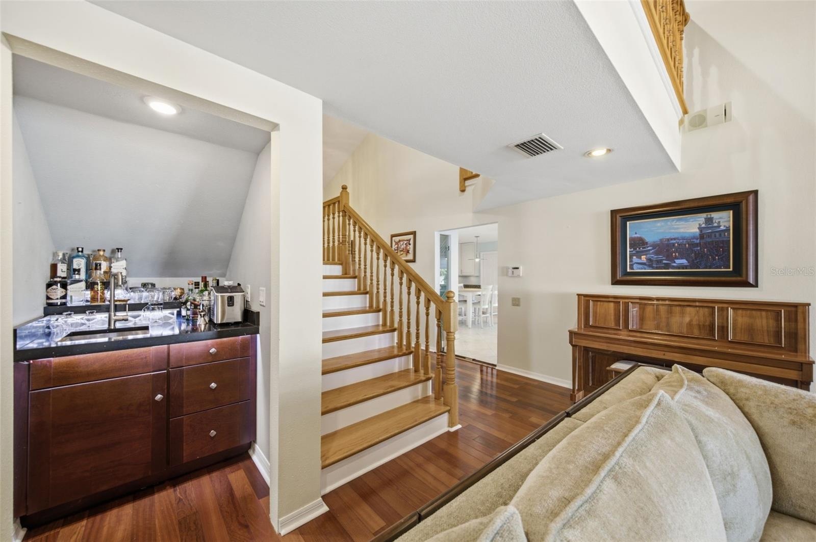 Great Room with wood flooring and 14' ceilings