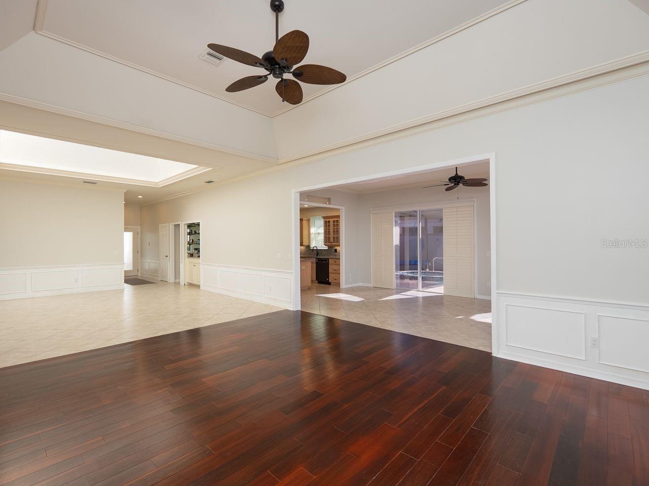Formal living room and dining with opening to family room and kitchen