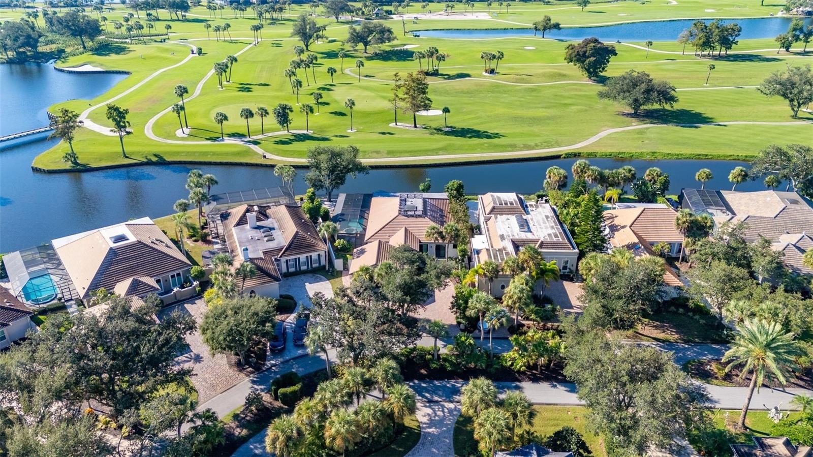 aerial of house on golf course and pond