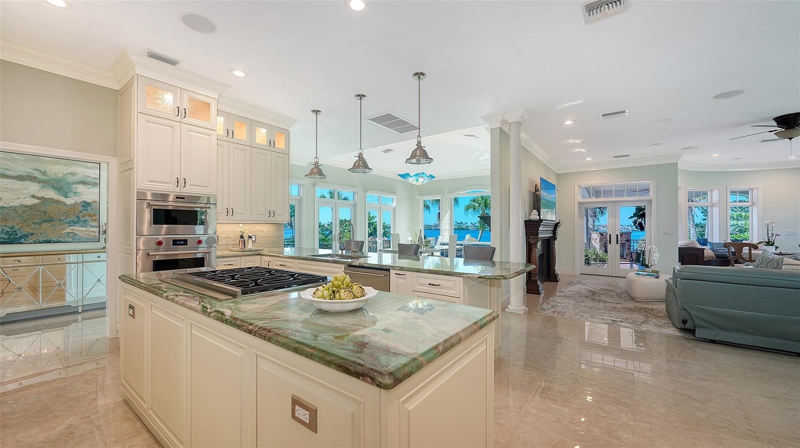 Kitchen looking out to the living area and dining room and expansive waterviews