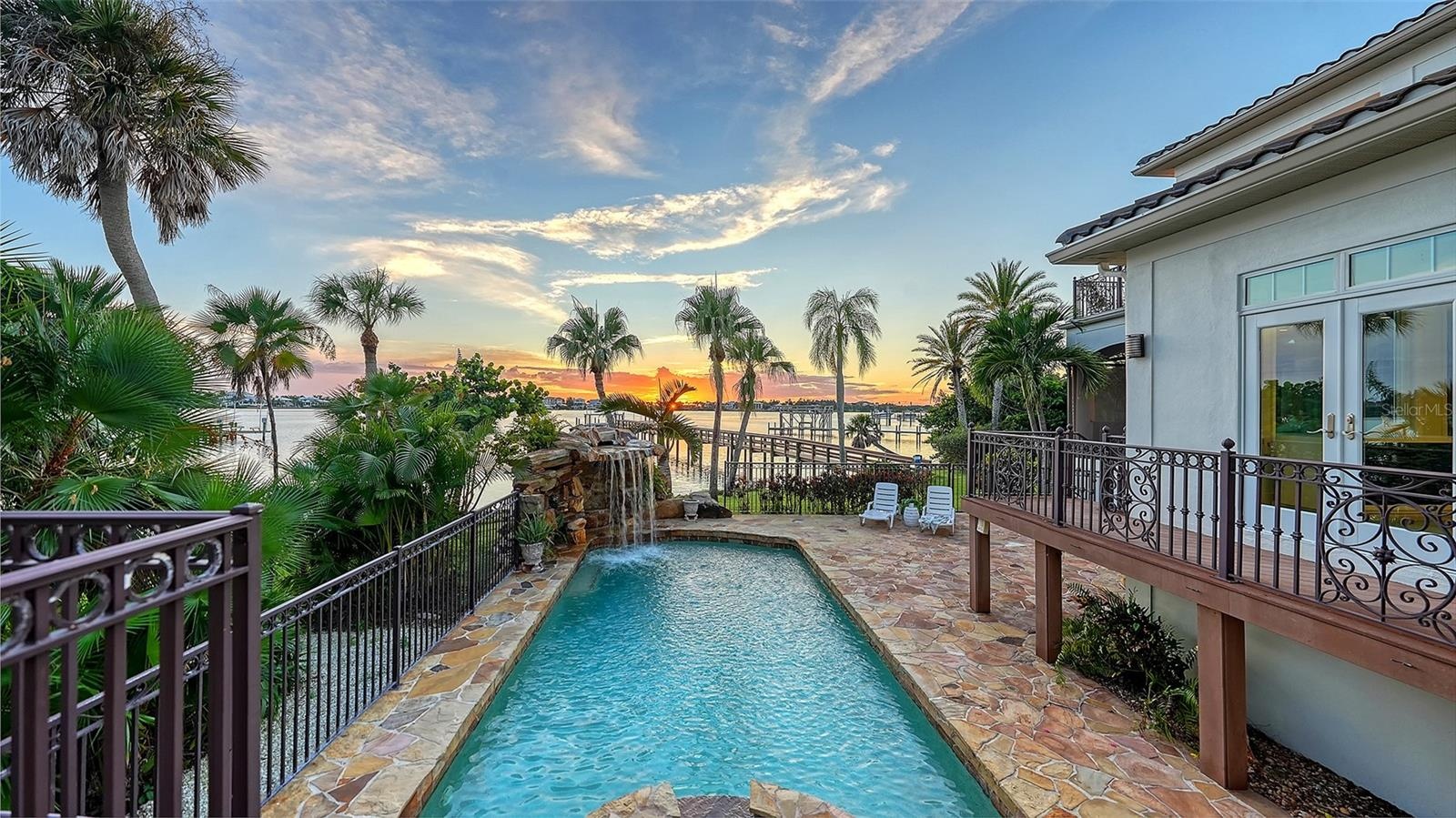 Easy access from kitchen/dining room/ outdoor living space/ first floor primary bedroom to the pool area