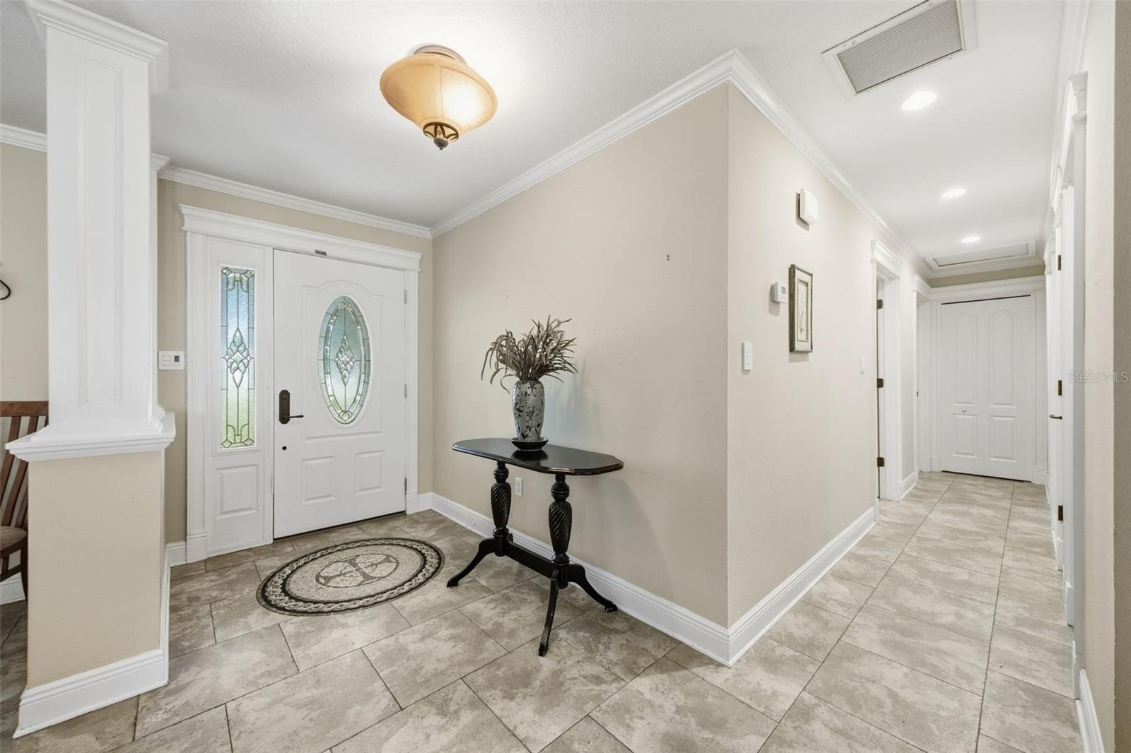 Hallway leads to 3 bedrooms and 2 baths.  Primary suite on opposite side of house.