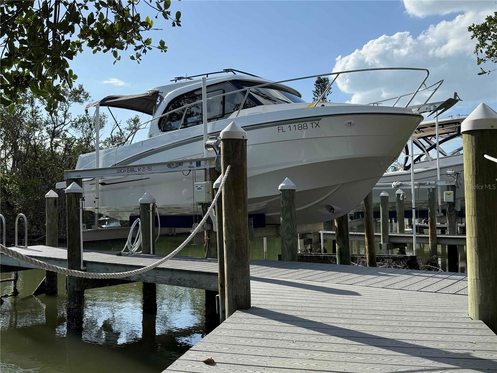 10,000 lb. capacity boat lift and dock included