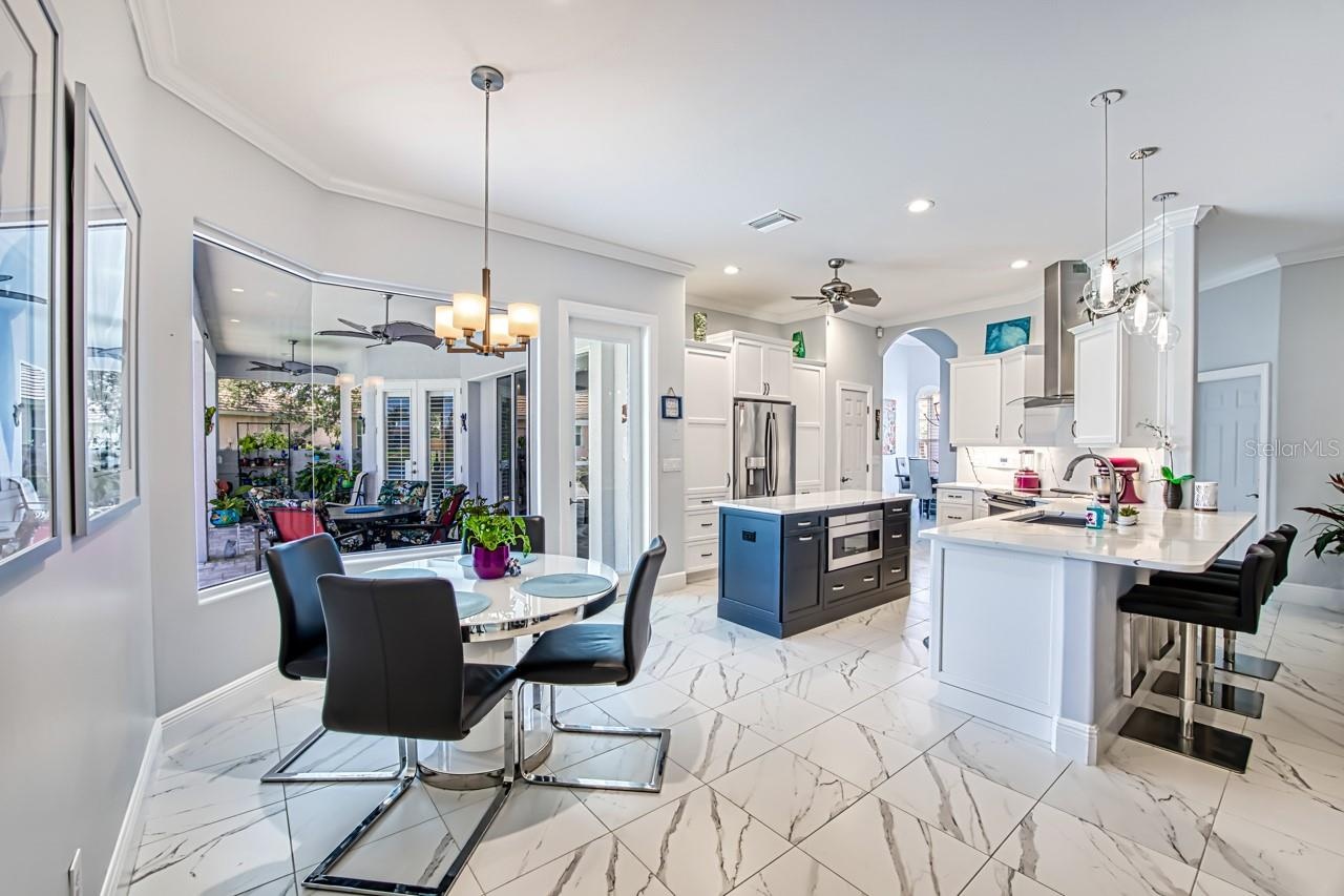 Dinette in Kitchen/Family room area.  Tile floor throughout the home.  Single height counter with seating