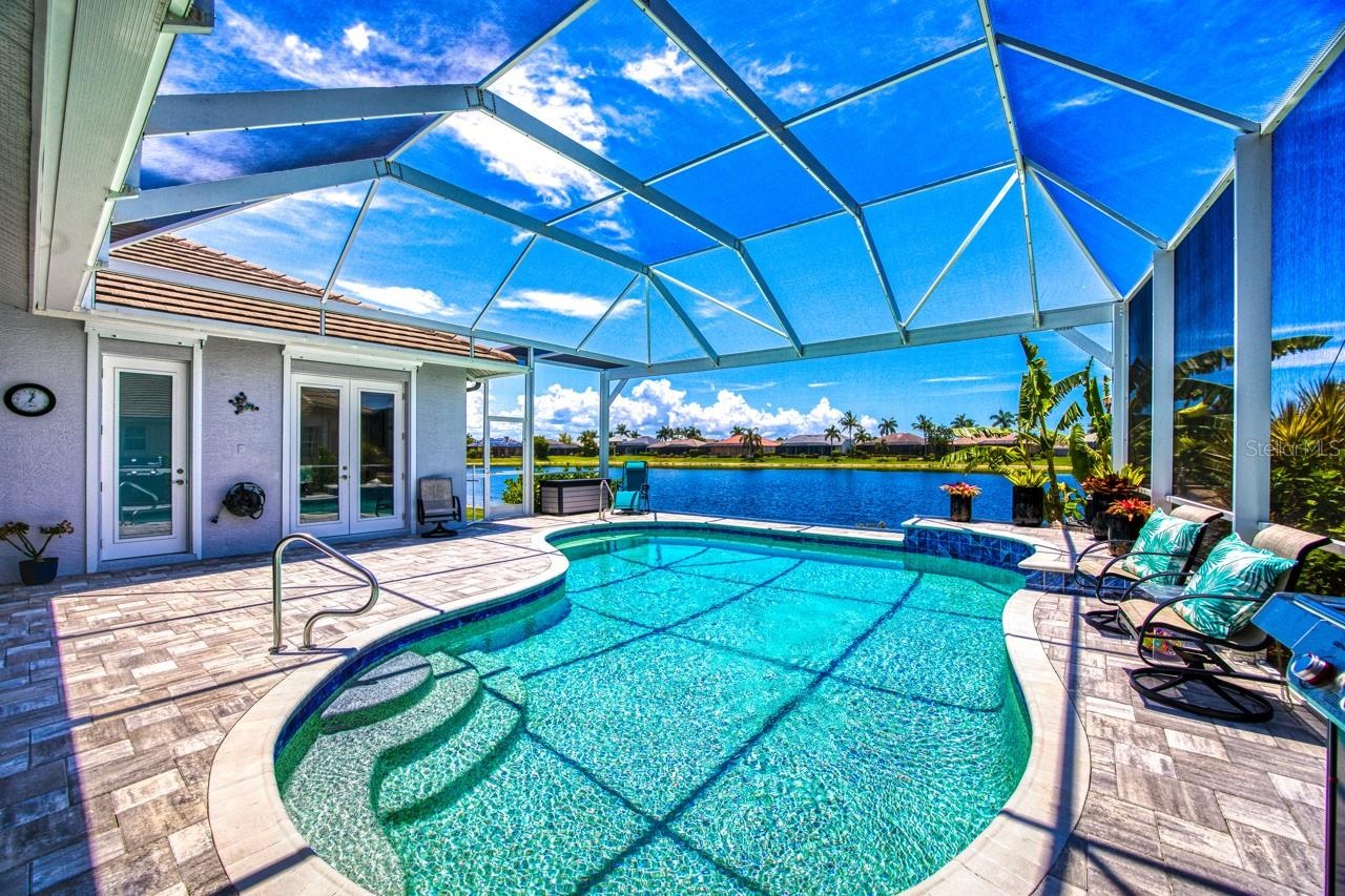 Screen lanai with picture window to lake in 2022