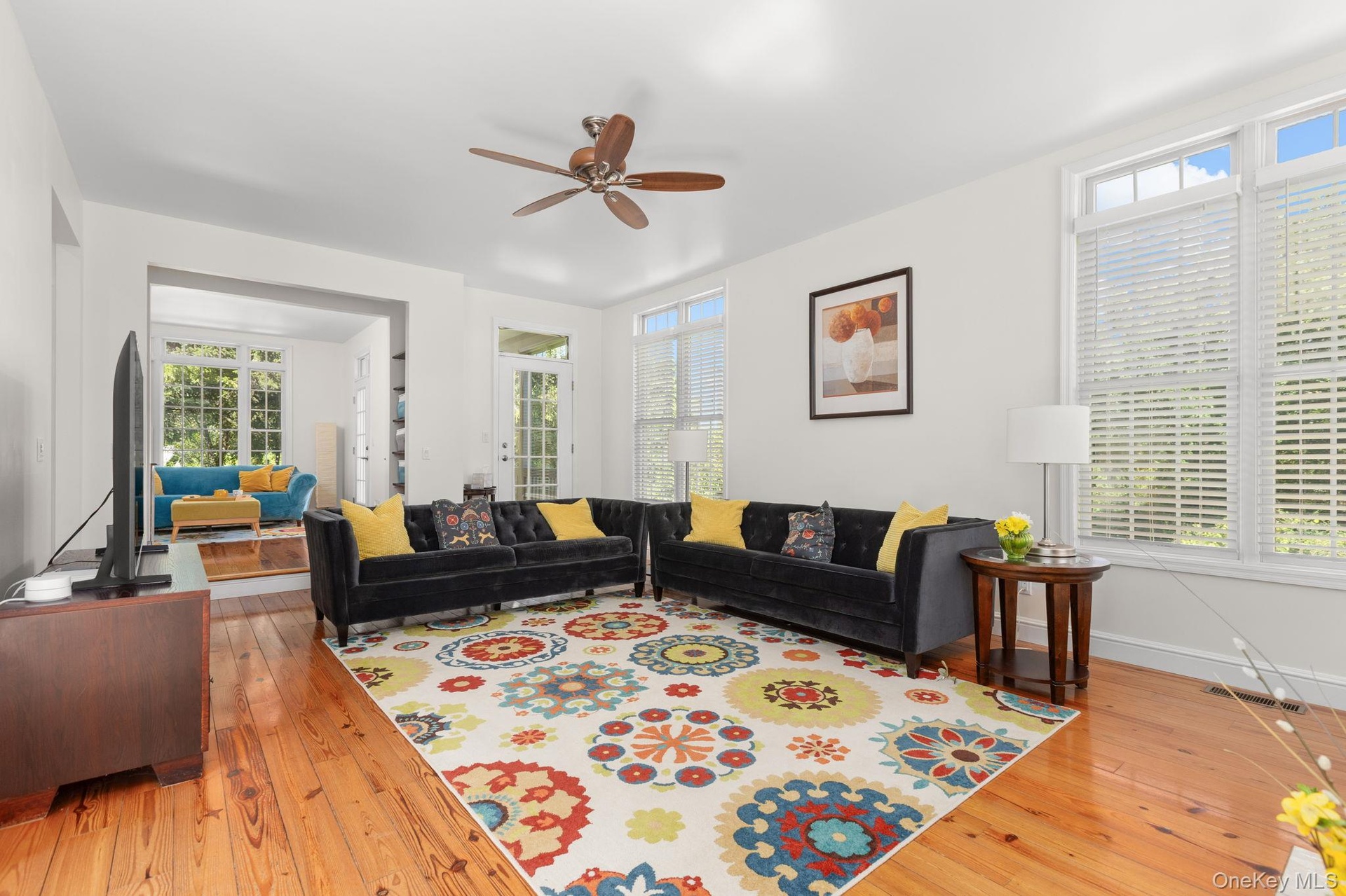 The sun-filled living room offers a versatile space designed for today’s work-life balance. Flowing seamlessly into the sitting room and kitchen, its 
