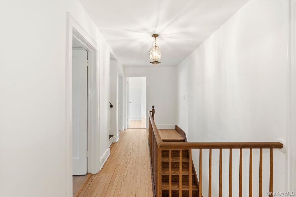 2nd floor landing and long hallway connecting 4 bedrooms