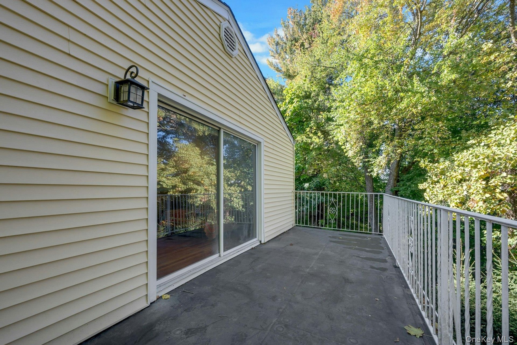 Sliding Glass Doors from the Primary Bedroom to the second floor porch.