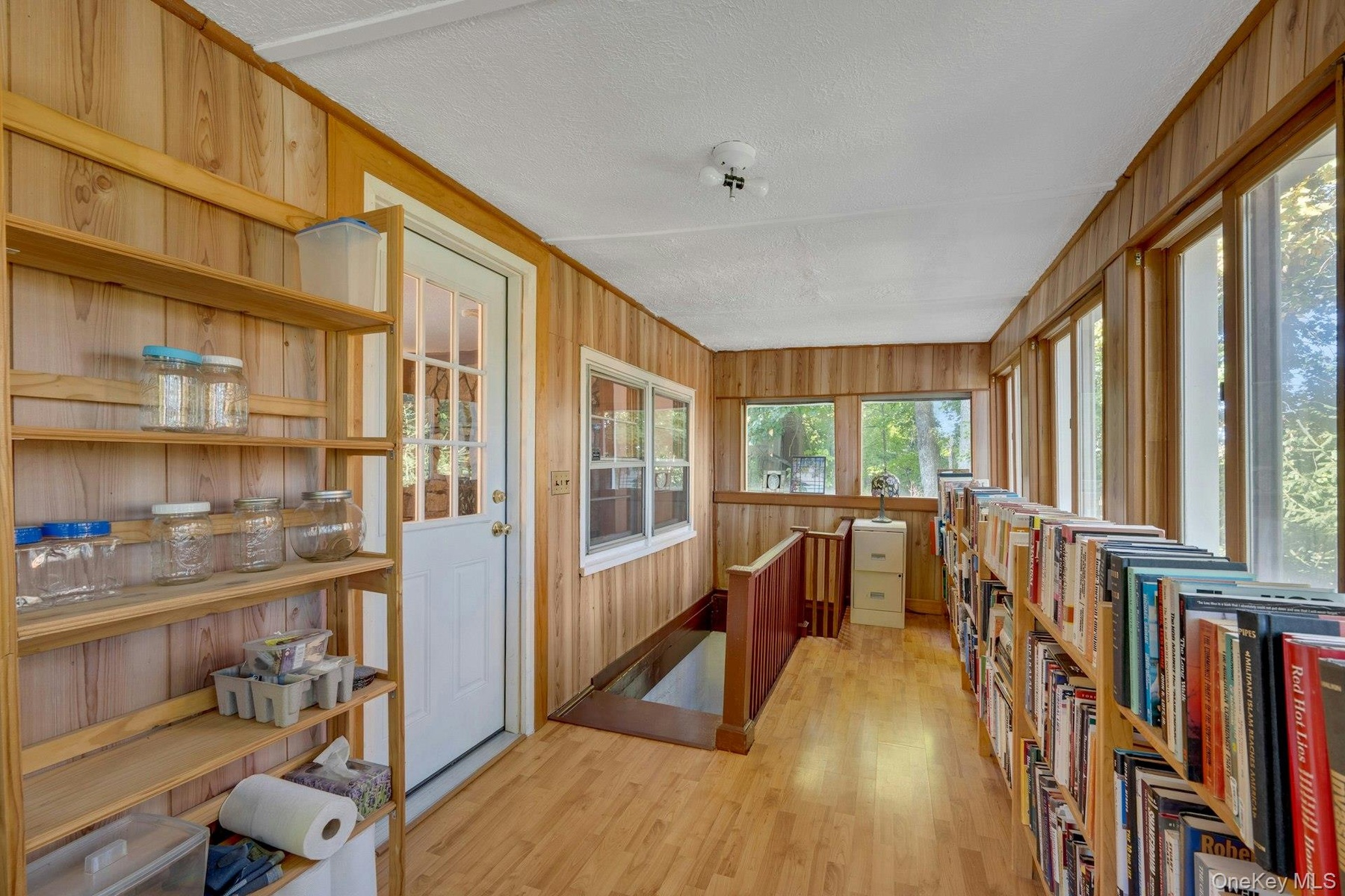 Turn this 3 Season Porch into an office or exercise room. It's sunny and has a gorgeous view.