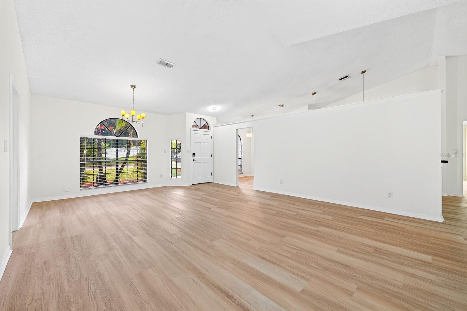 Located in a desirable GOLF COMMUNITY with a LOW HOA, this home makes a great first impression and welcomes you inside with soaring vaulted ceilings a