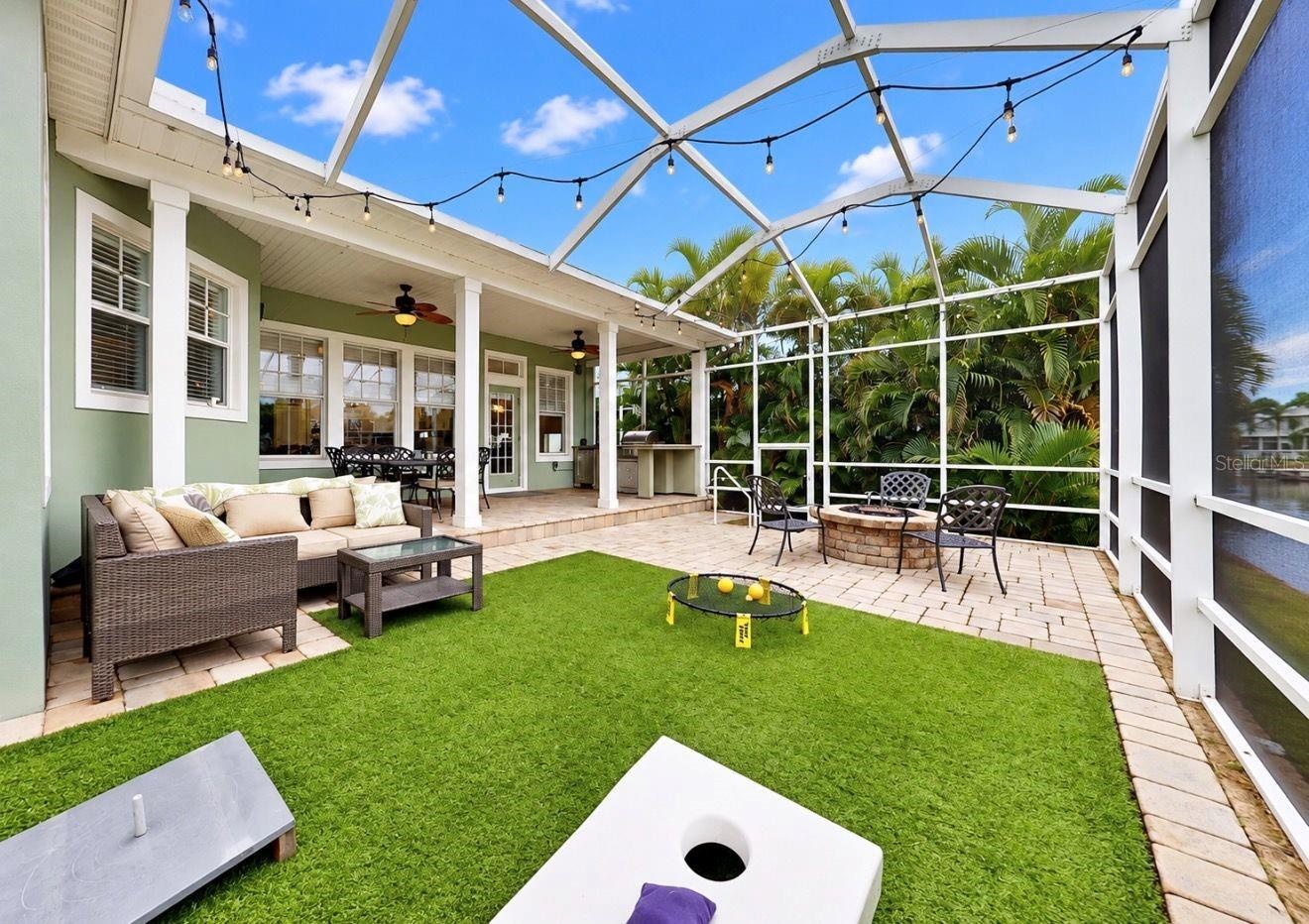 Screened backyard with Astroturf