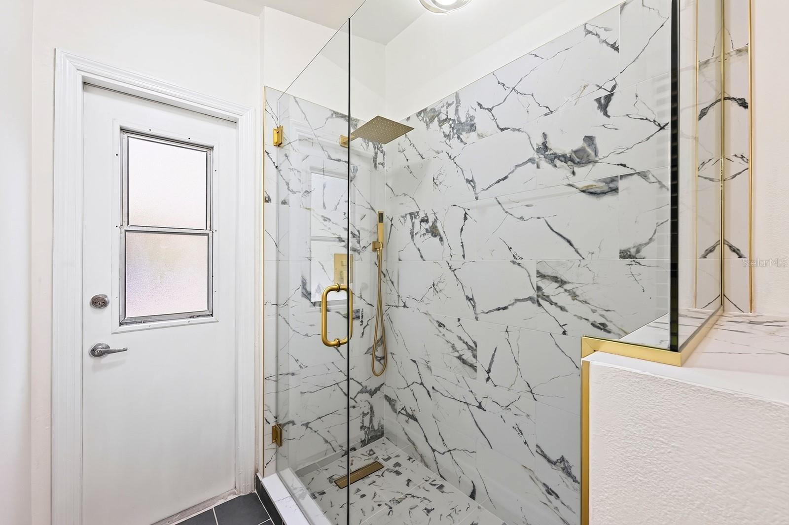 The second full Bath, also COMPLETELY UPDATED IN 2026, features dual sinks, a walk-in shower and a convenient door leading directly to the pool area.