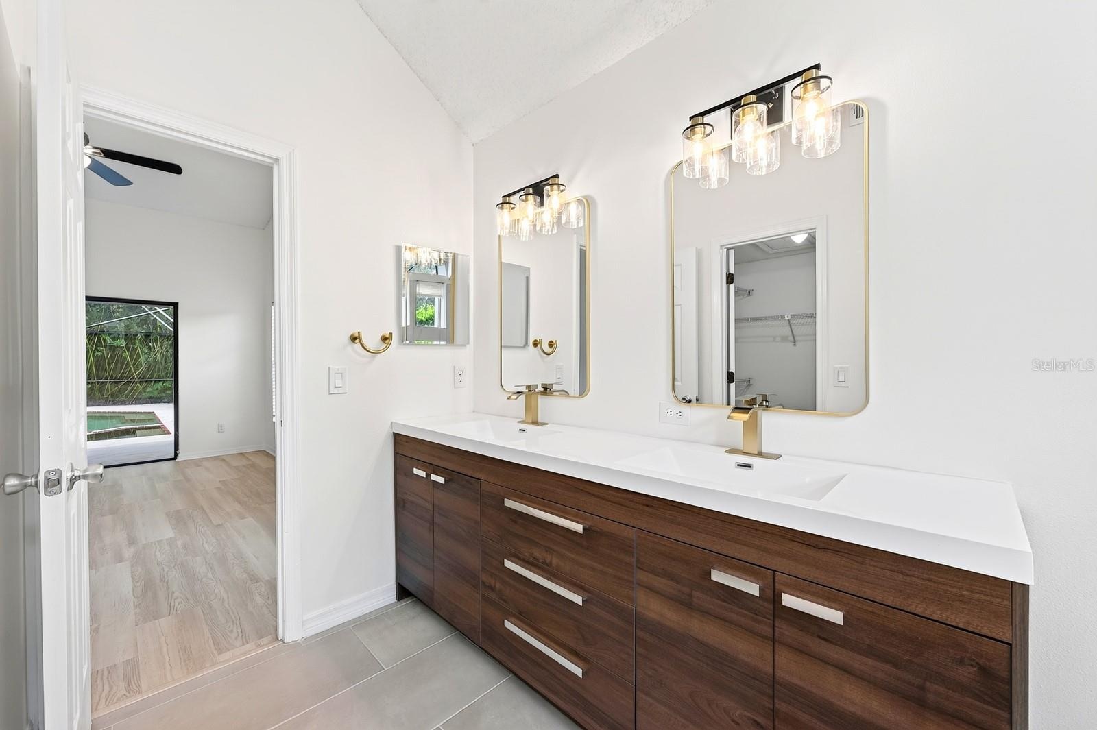 The Primary en suite Bath has been COMPLETELY UPDATED IN 2026 with dual sinks, a garden tub, a step-in shower and stylish MARBLE-LOOK tile walls.