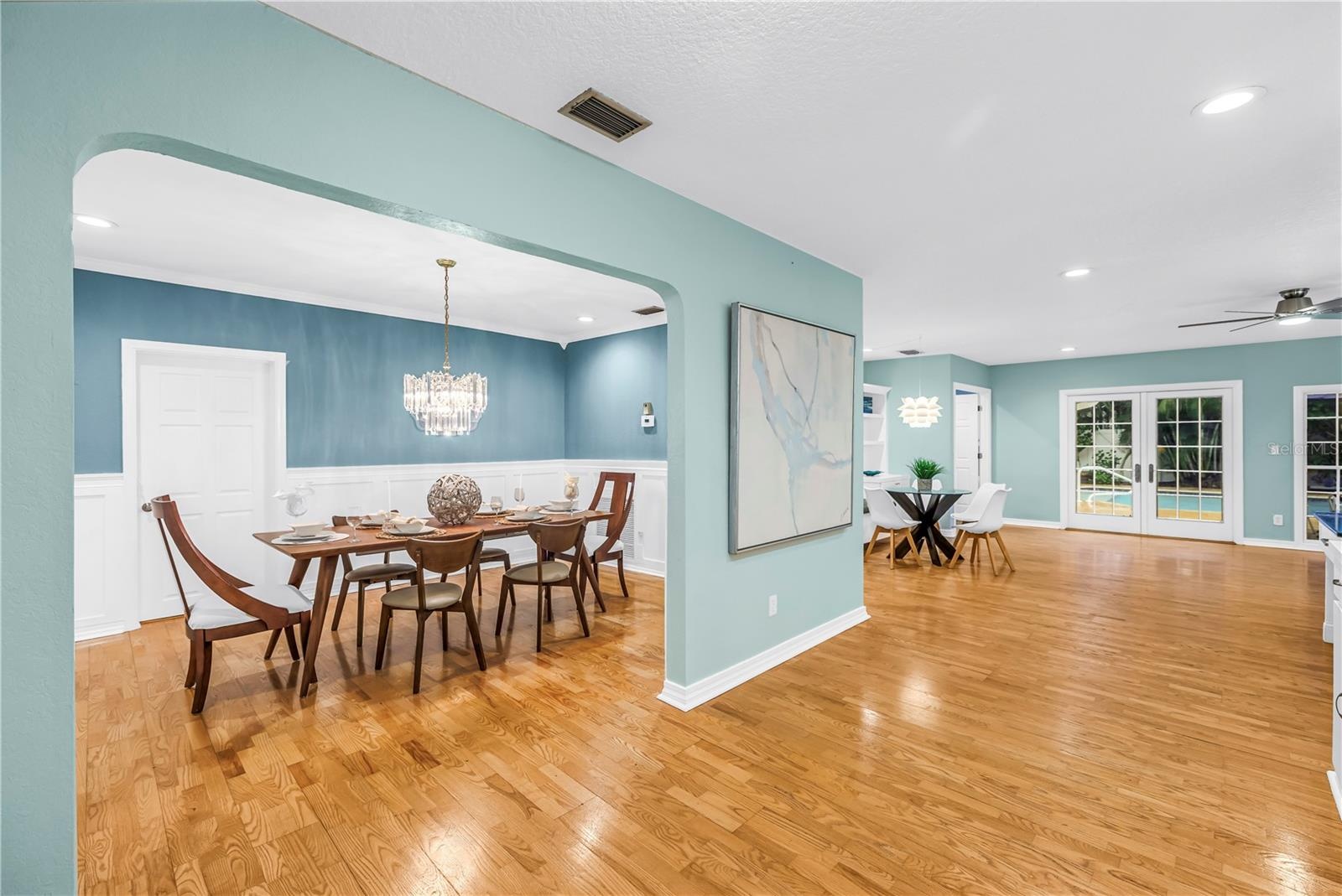 This open-concept dining area flows seamlessly into the surrounding living spaces, perfect for more social gathering