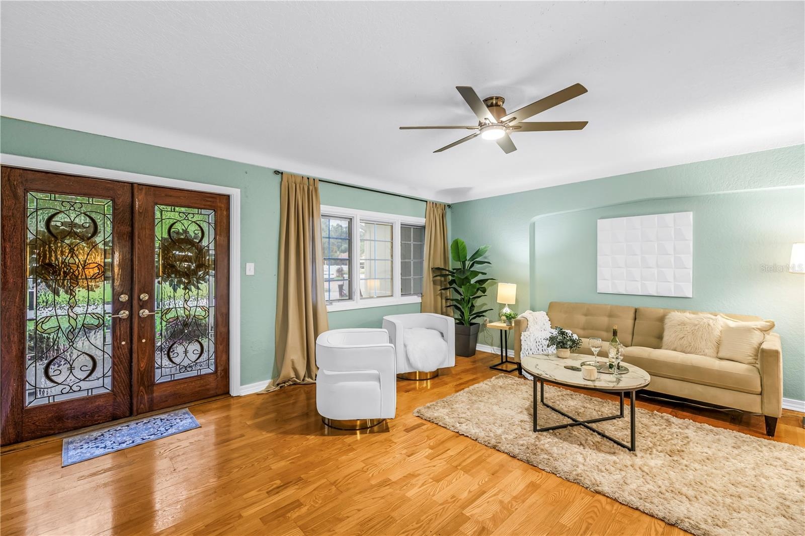 The formal living area, situated in one of St. Petersburg's most prestigious neighborhoods, offers an elegant space perfectly suited for greeting and 