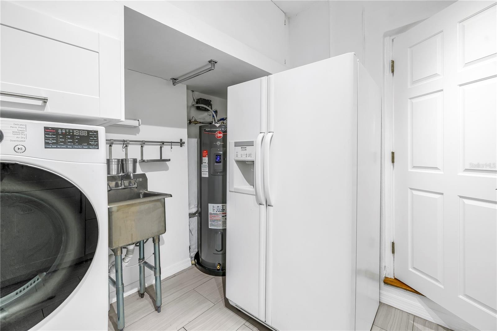 Brand new high-efficiency, whole-house smart water heater.  Beverage or additional capacity refrigerator