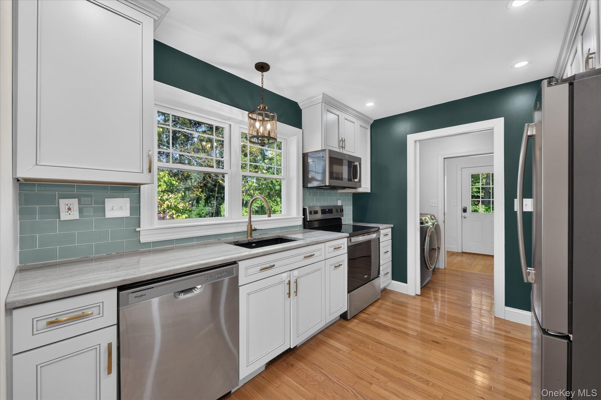 Kitchen With View Of Laundry Room And Back Mudroom