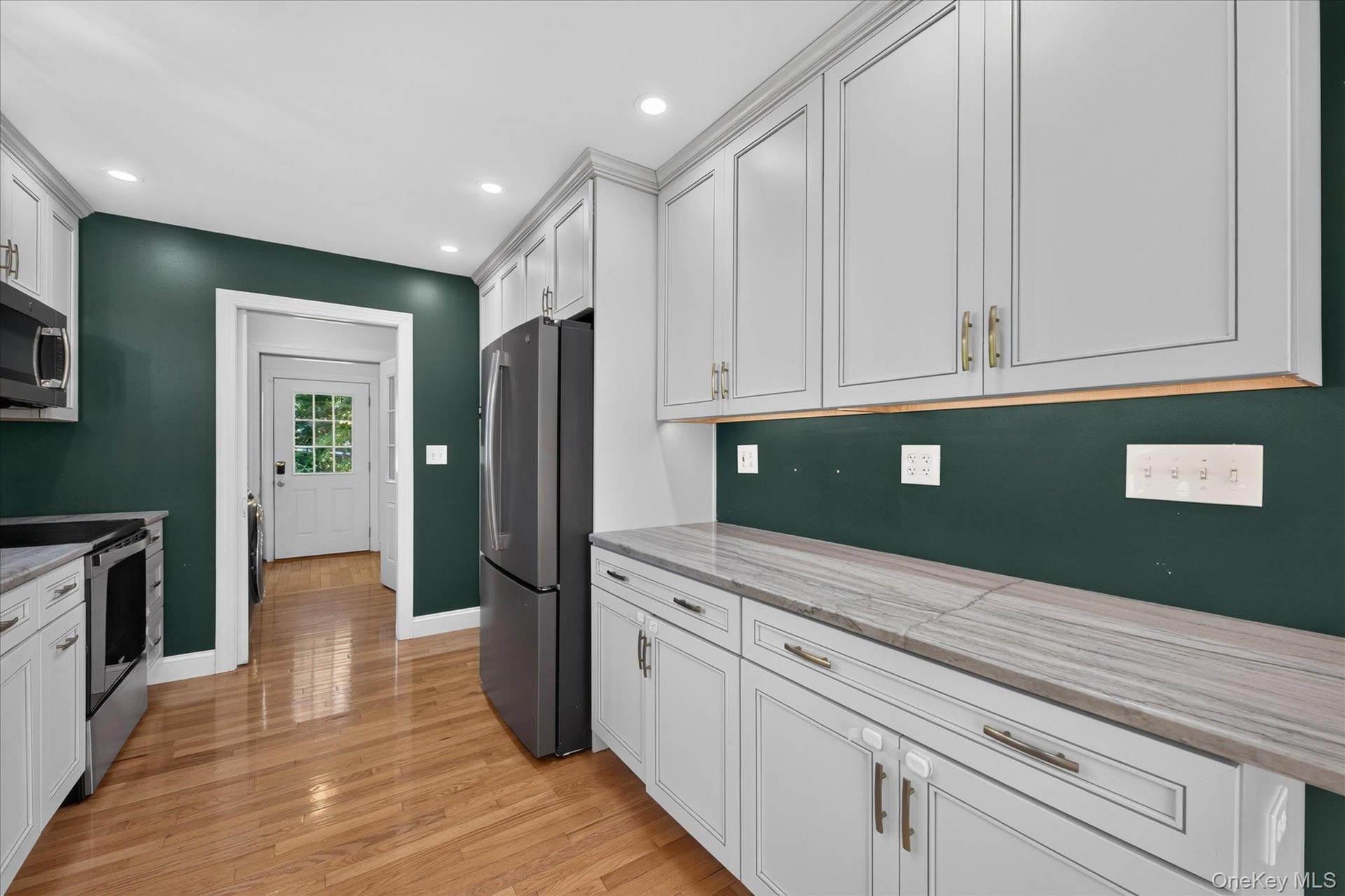 Kitchen With View Of Laundry Room And Back Mudroom