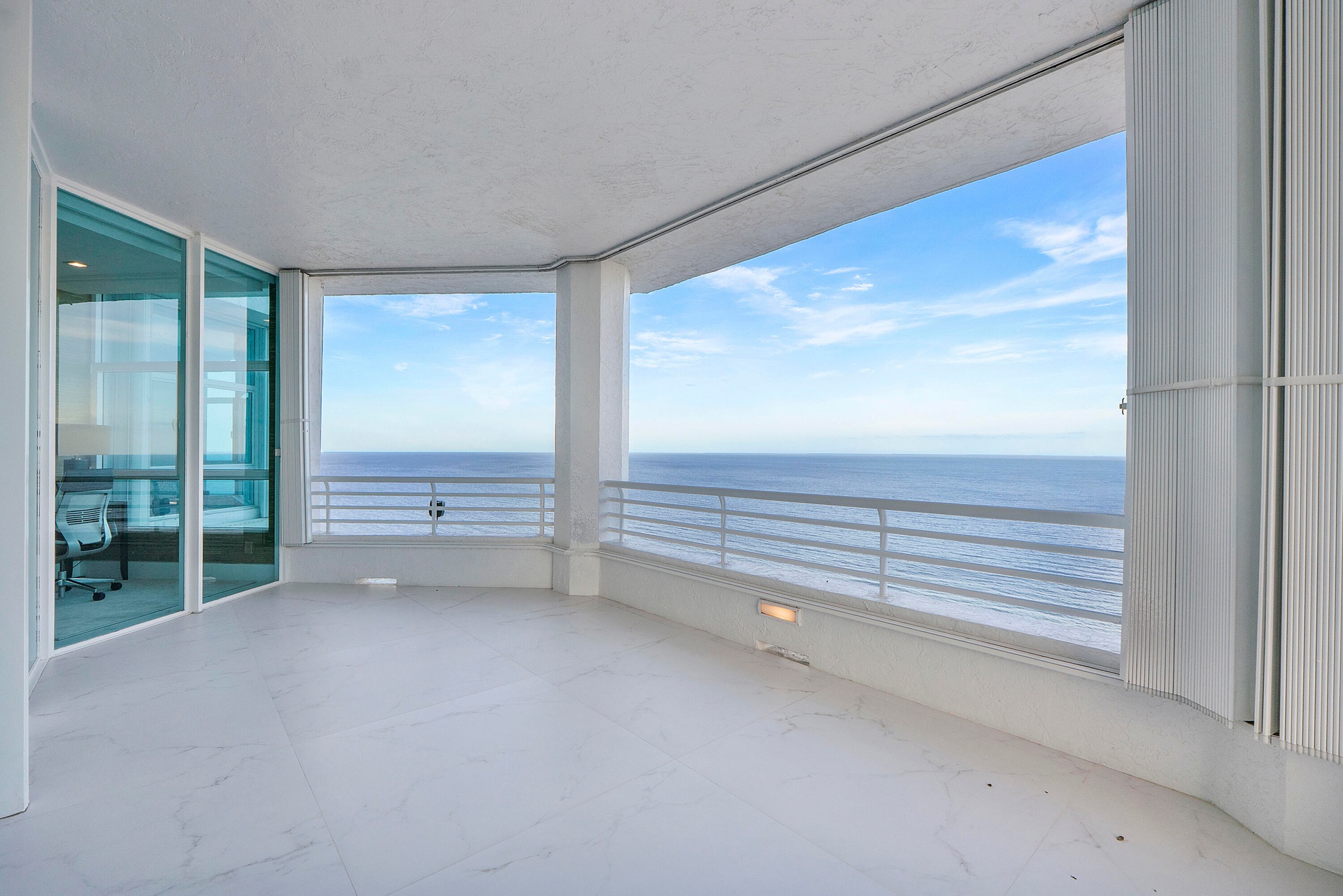 An impressive 1,600 square feet of imported European porcelain-clad terraces wrap gracefully around the entire penthouse, extending from every floor-t