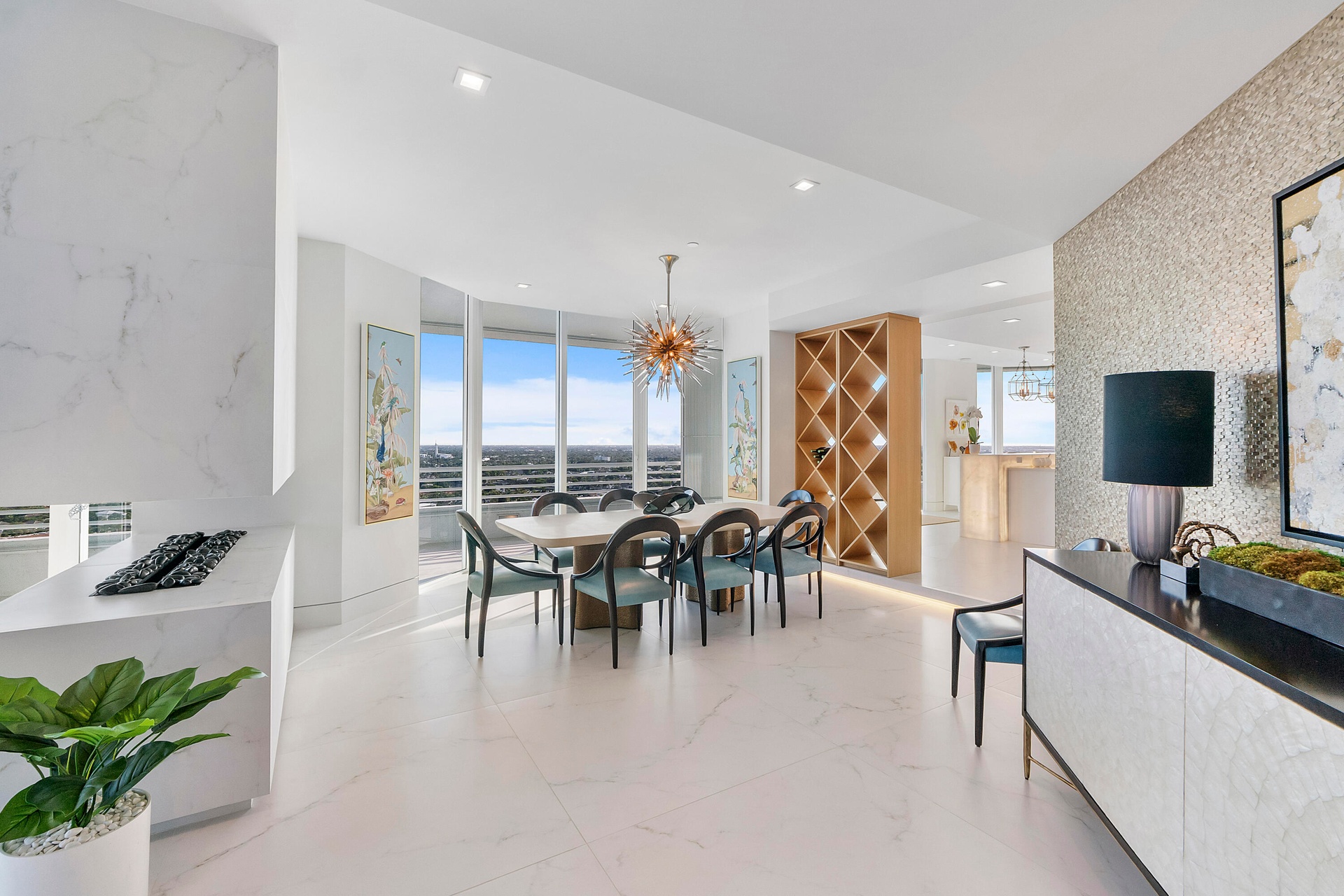 The formal dining room is perfectly positioned to capture breathtaking panoramic western views across the Intracoastal Waterway and all of Broward Cou