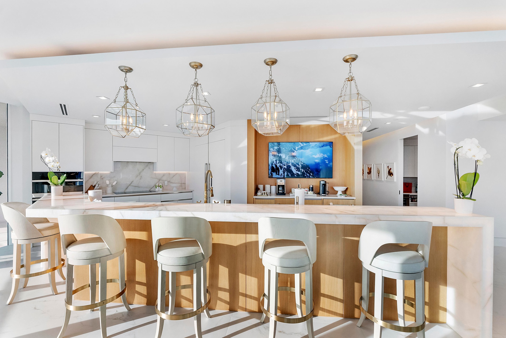Exceptionally spacious and beautifully designed, this magnificent chef's kitchen transforms entertaining into an experience. The grand backlit Cristel