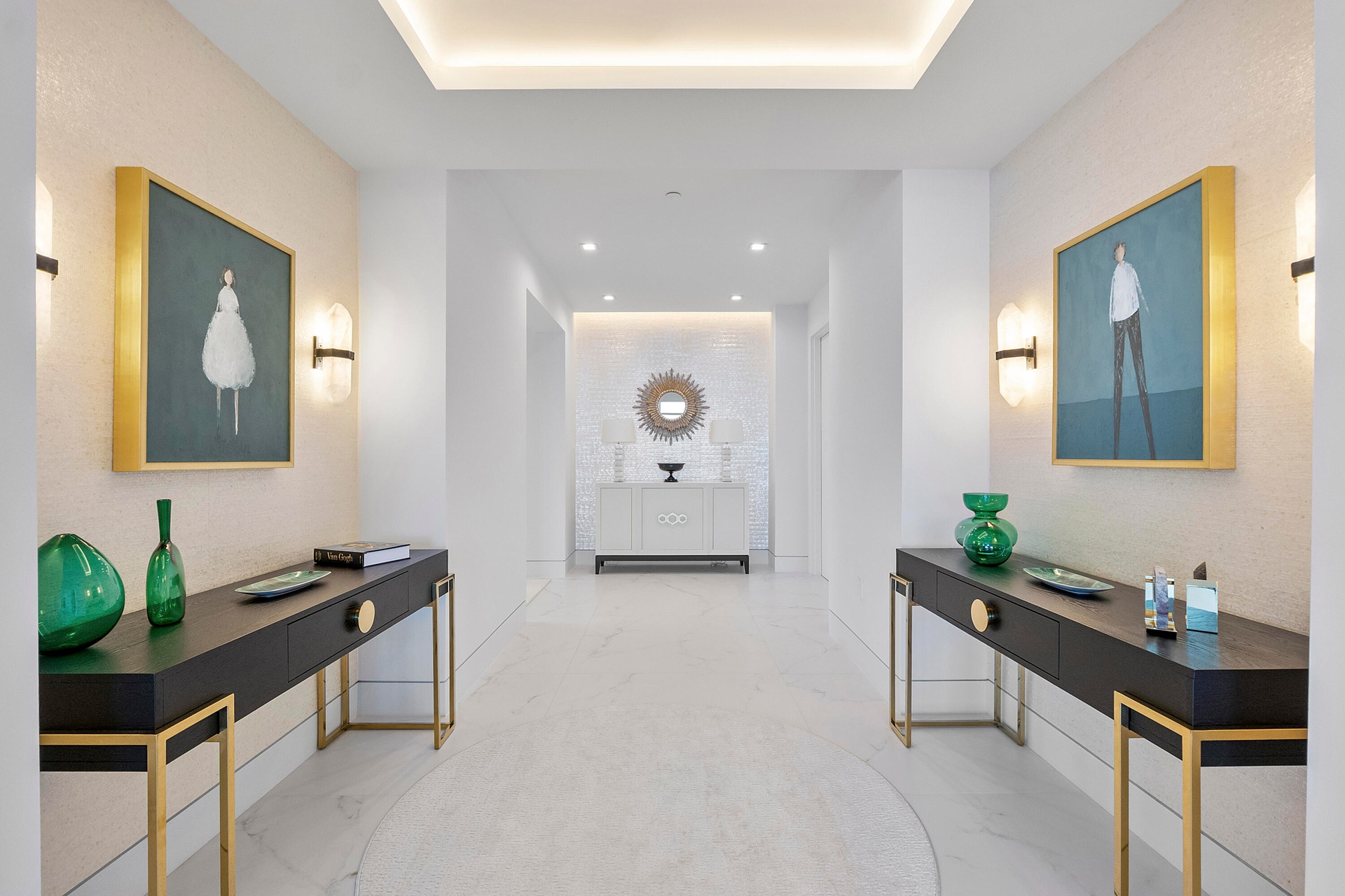 This is the stunning foyer as you walk into the Penthouse, The entry double doorway is to the right of the gold circle Foyer mirror, This entryway is 