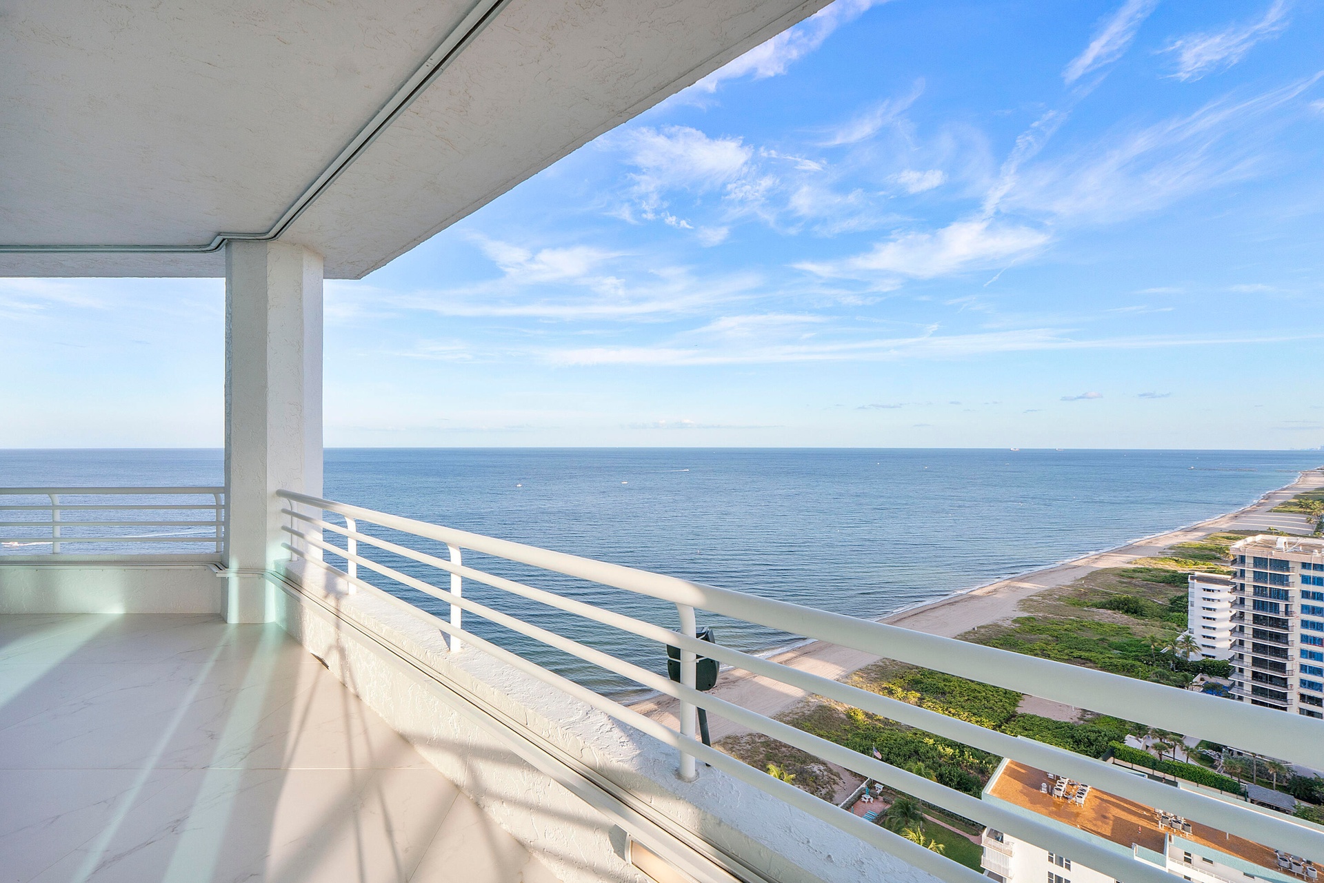 Sweeping southeast views unfold from the penthouse’s wide, covered European-porcelain balcony, capturing the turquoise Atlantic, miles of Fort Lauderd