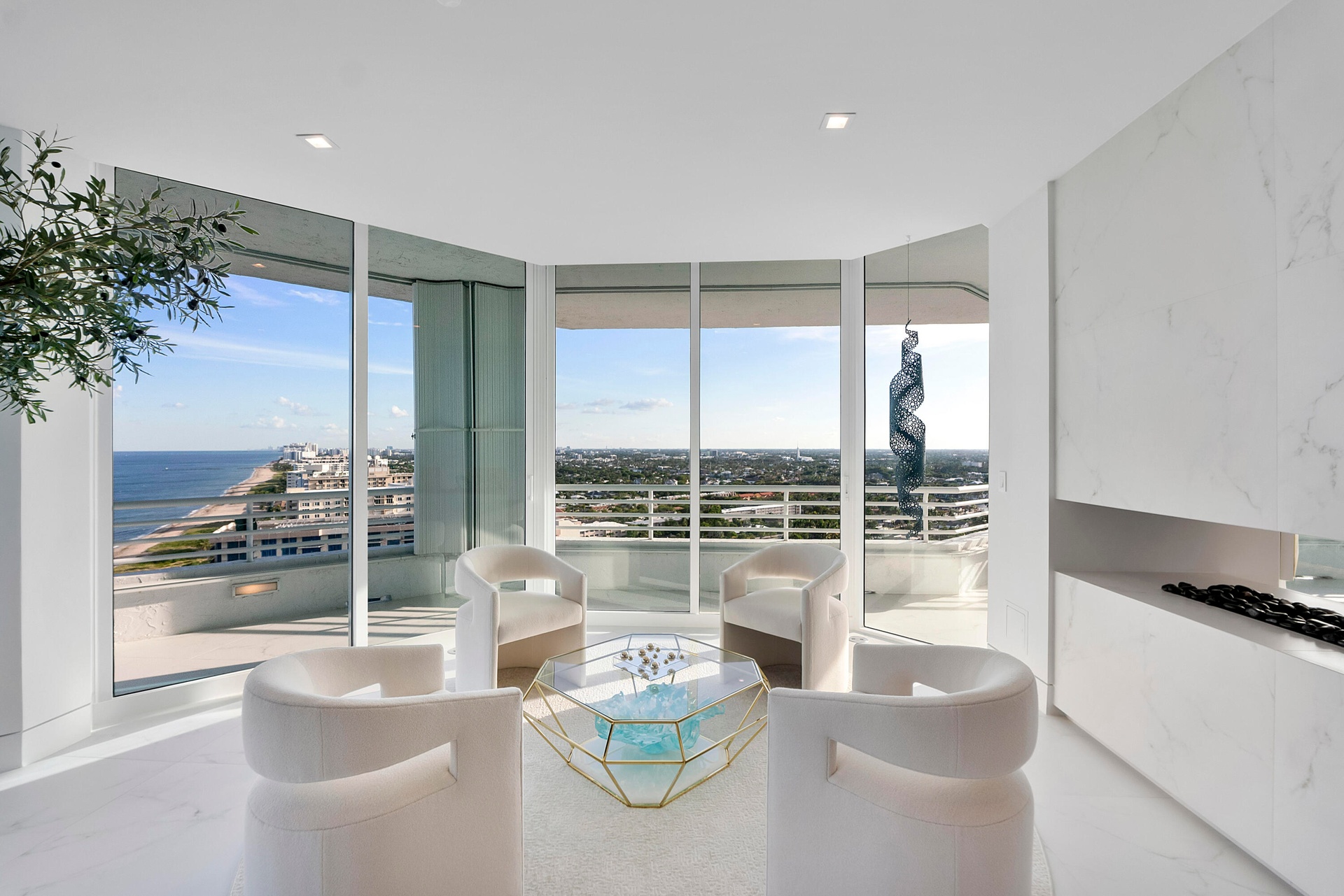 Nearly every room opens to spectacular outdoor living, where expansive wraparound balconies provide a front-row seat to sunrise over the Atlantic and 