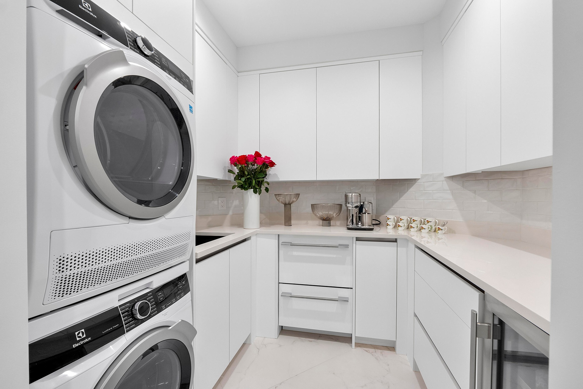 Discreetly concealed near the Primary Suite and Rose Room, this thoughtfully designed secondary butler’s pantry adds another layer of effortless luxur