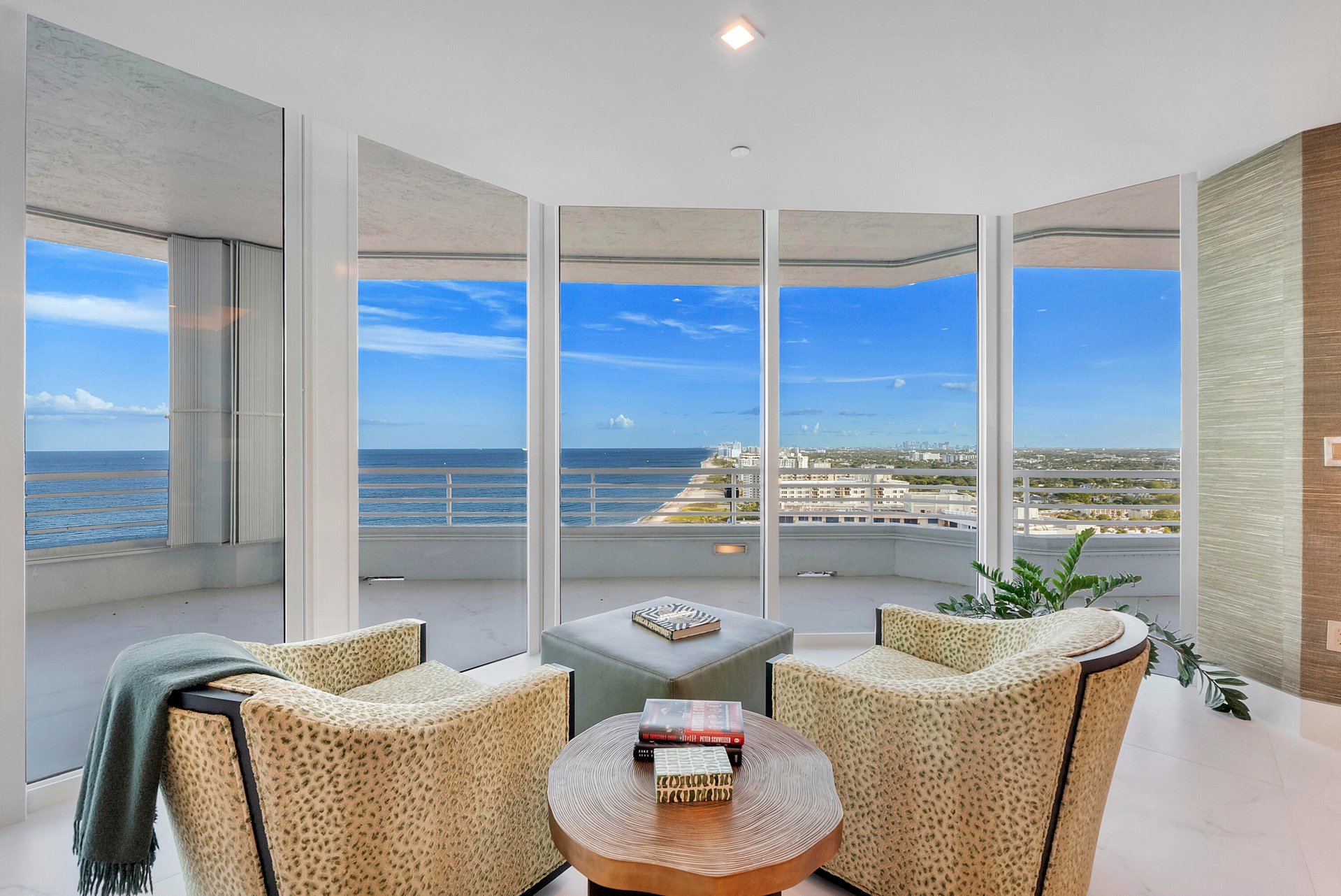A Private Sanctuary Above the Atlantic — Nestled within the primary suite, this serene sitting room feels suspended between sea and sky. Dramatic floo