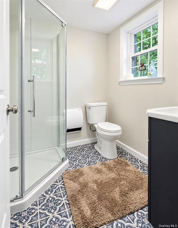 Lower level bathroon with shower for guests.