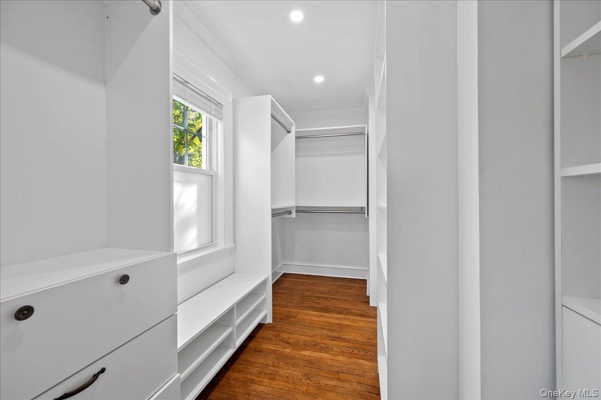 Primary Walk-In Closet Outfitted