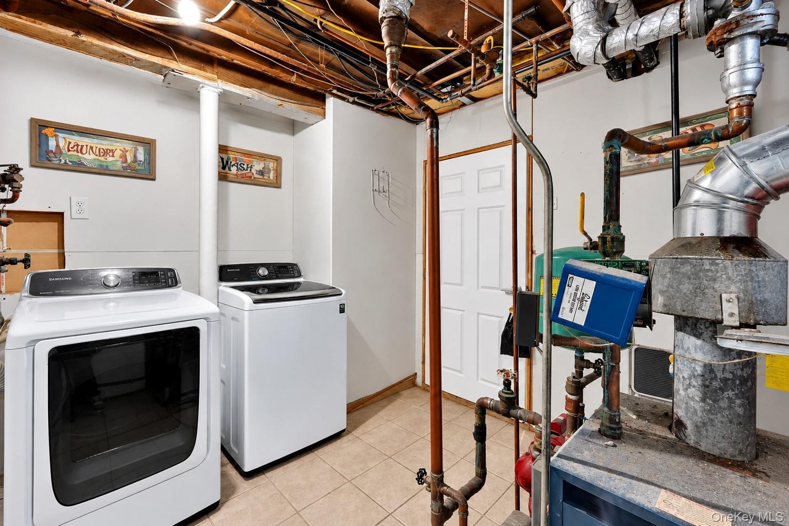 Utility space featuring tile flooring, exposed ceiling joists, and a six-panel door