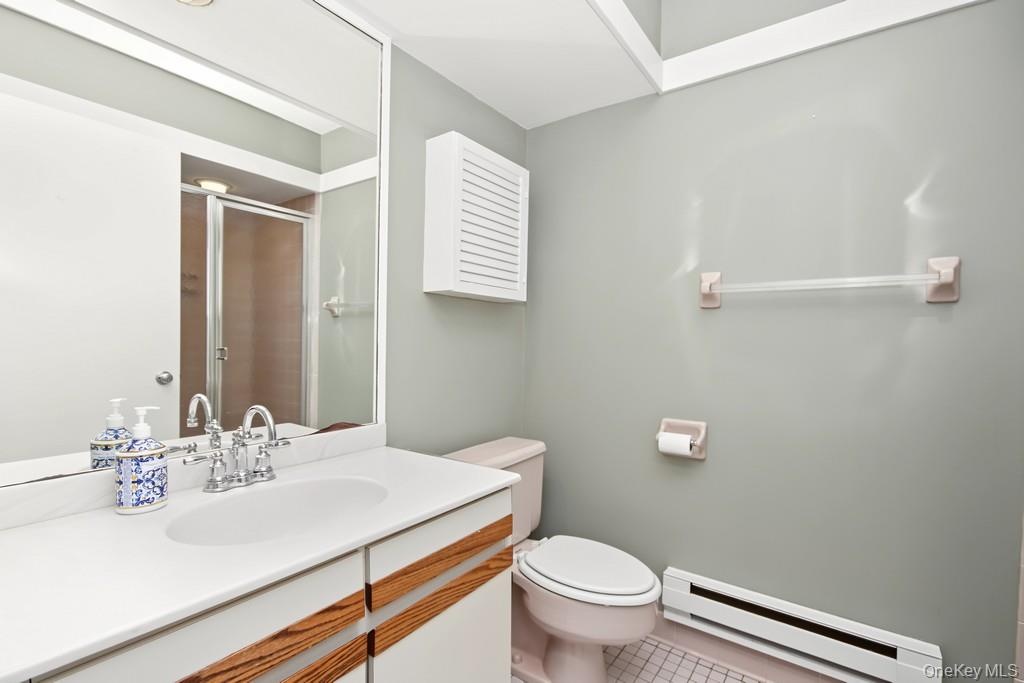 Second Bathroom has sink with vanity and stall shower