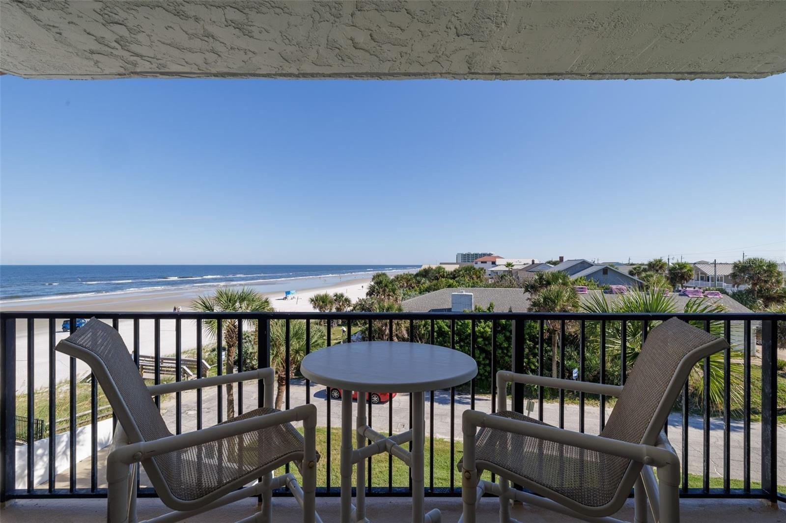 Balcony provides a great space to relax & feel the breeze & hear the waves!