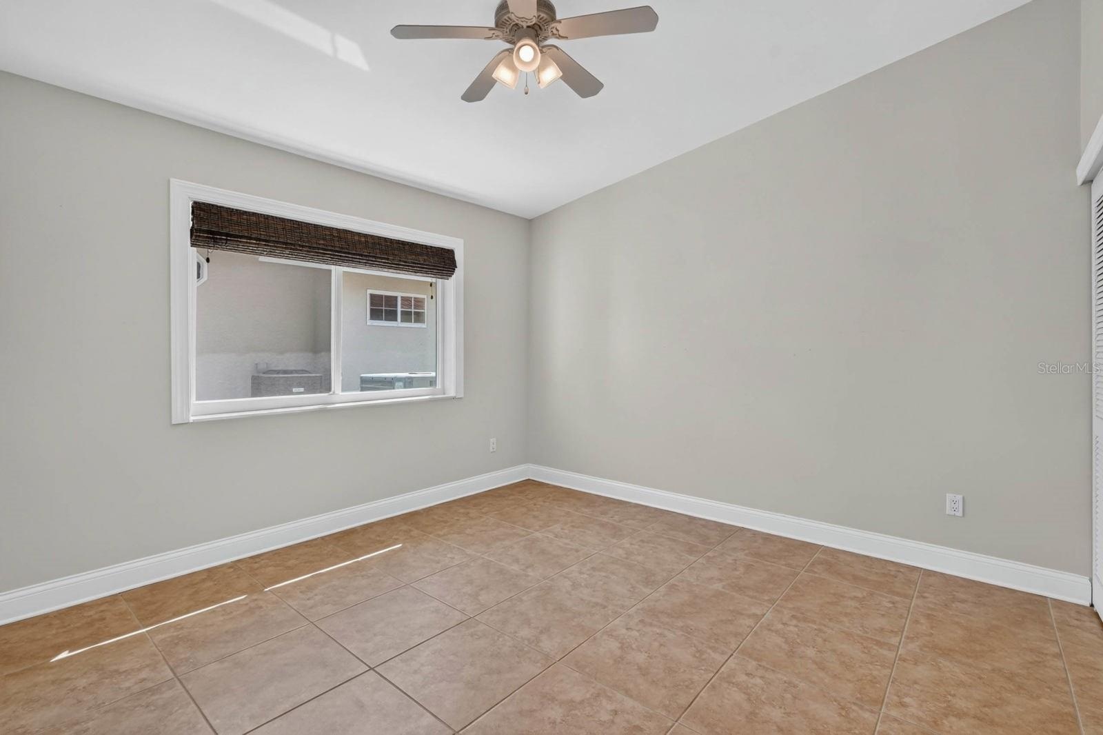 Bright Bedroom With Tile Flooring