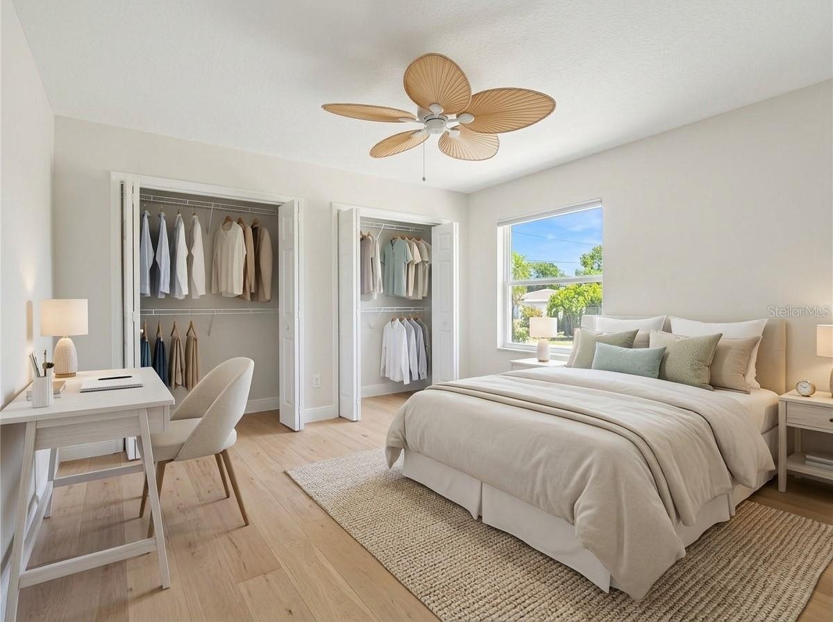 Spacious bedroom featuring dual closets.