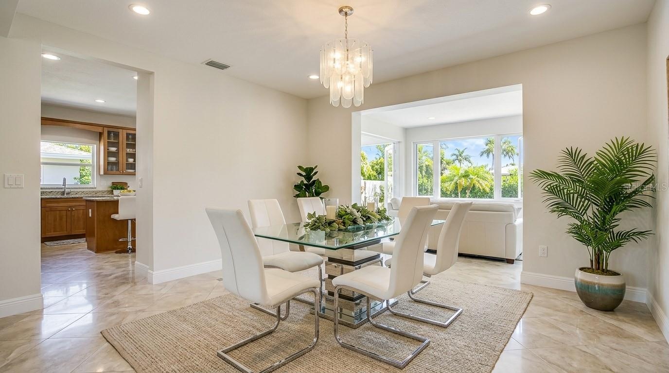 Bright, spacious formal dining room with elegant finishe