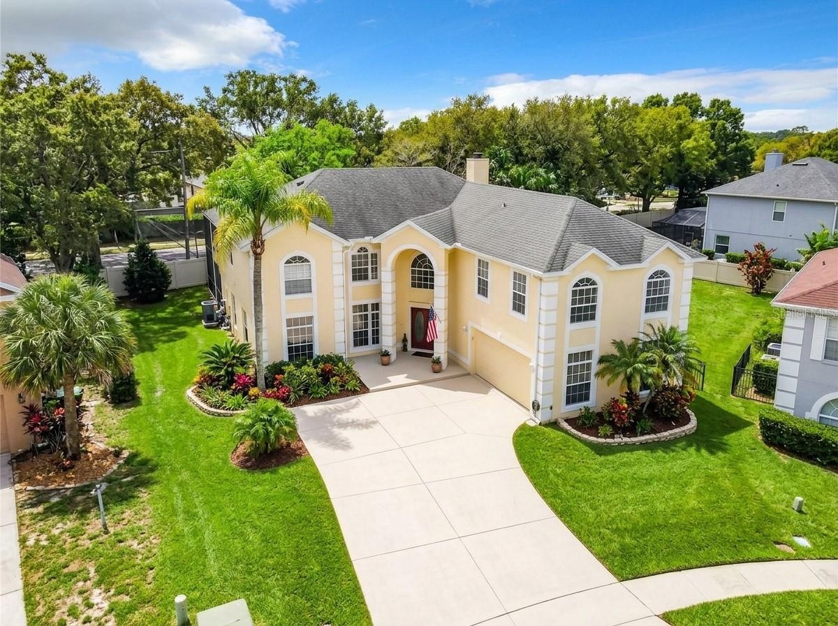Aerial view of the property entrance and roofline.