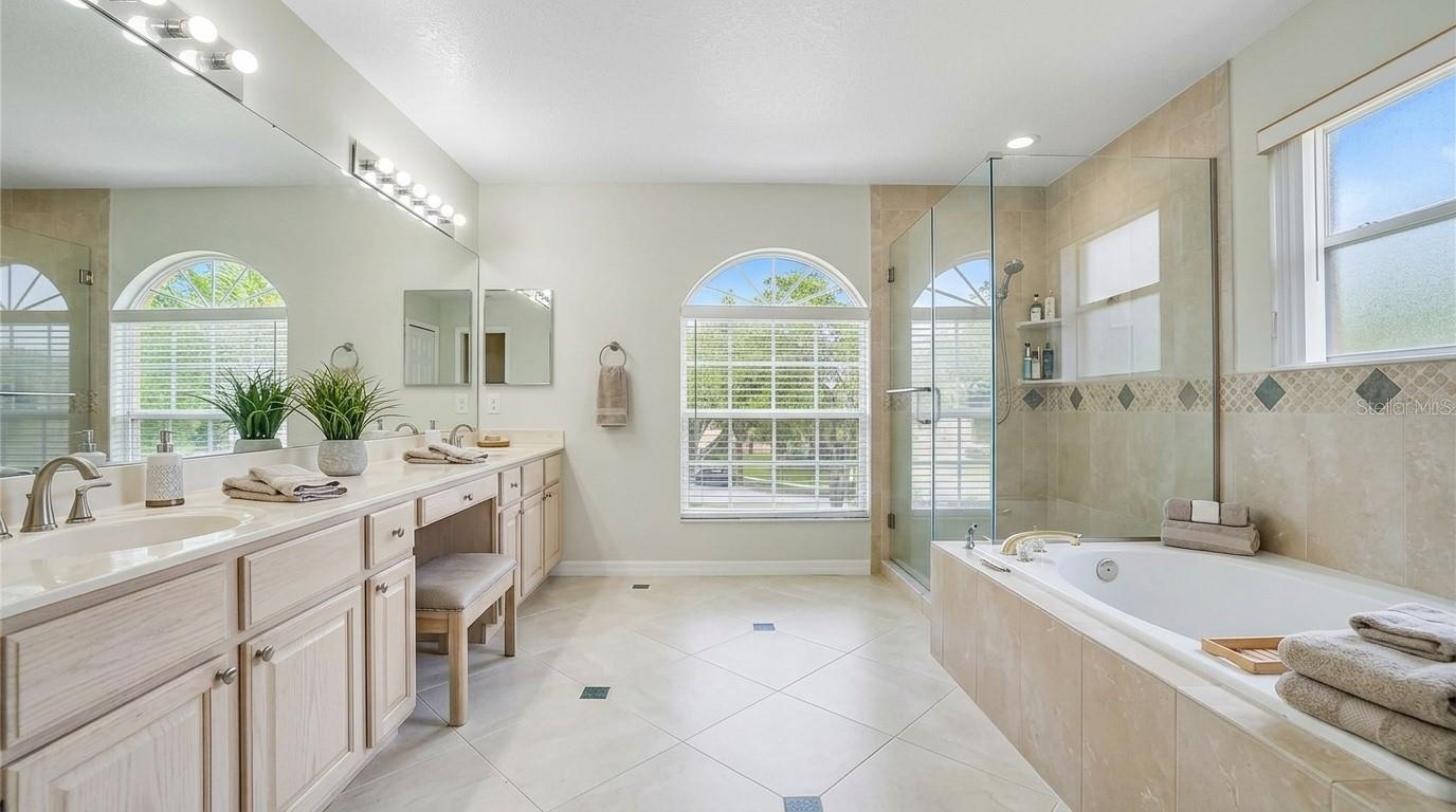 Master bathroom featuring a soaking tub.
