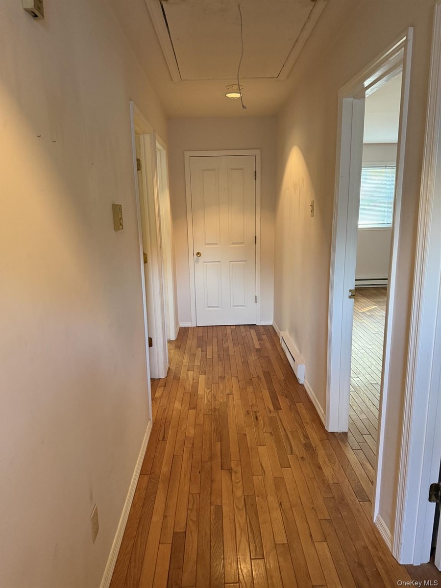 Upstairs hallway with bathroom and 3 generous sized bedrooms