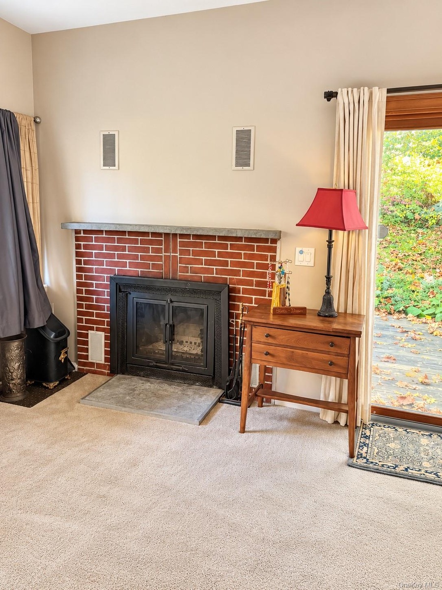 Living room with brick fireplace for the cozy winter nights
