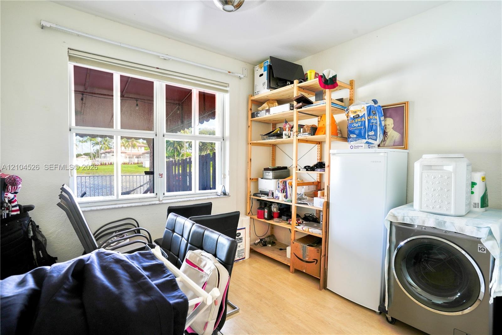 Multi-pane window with a horizontal roller mechanism and wood-finish flooring
