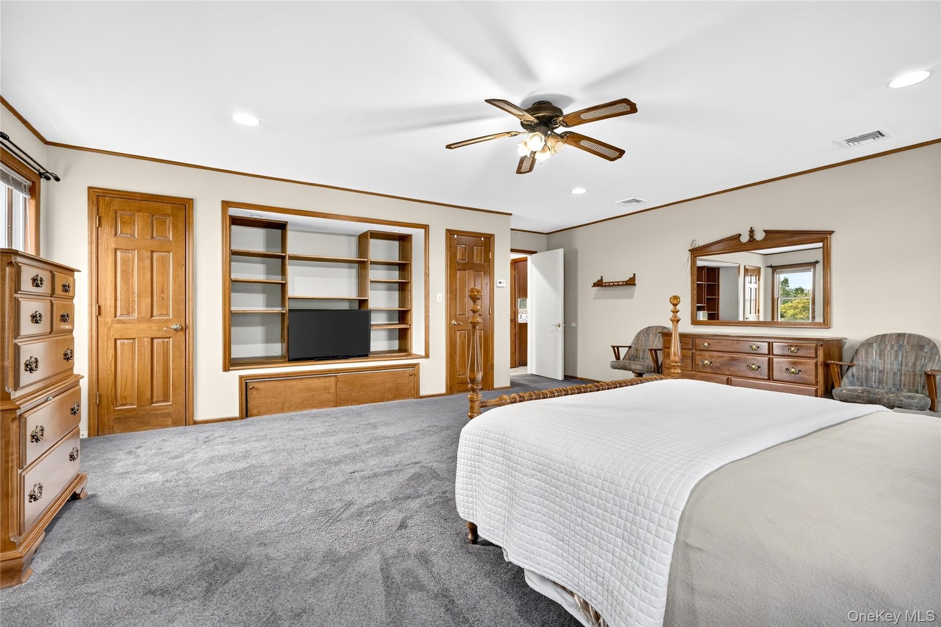 First floor bedroom with wall to wall carpeting.