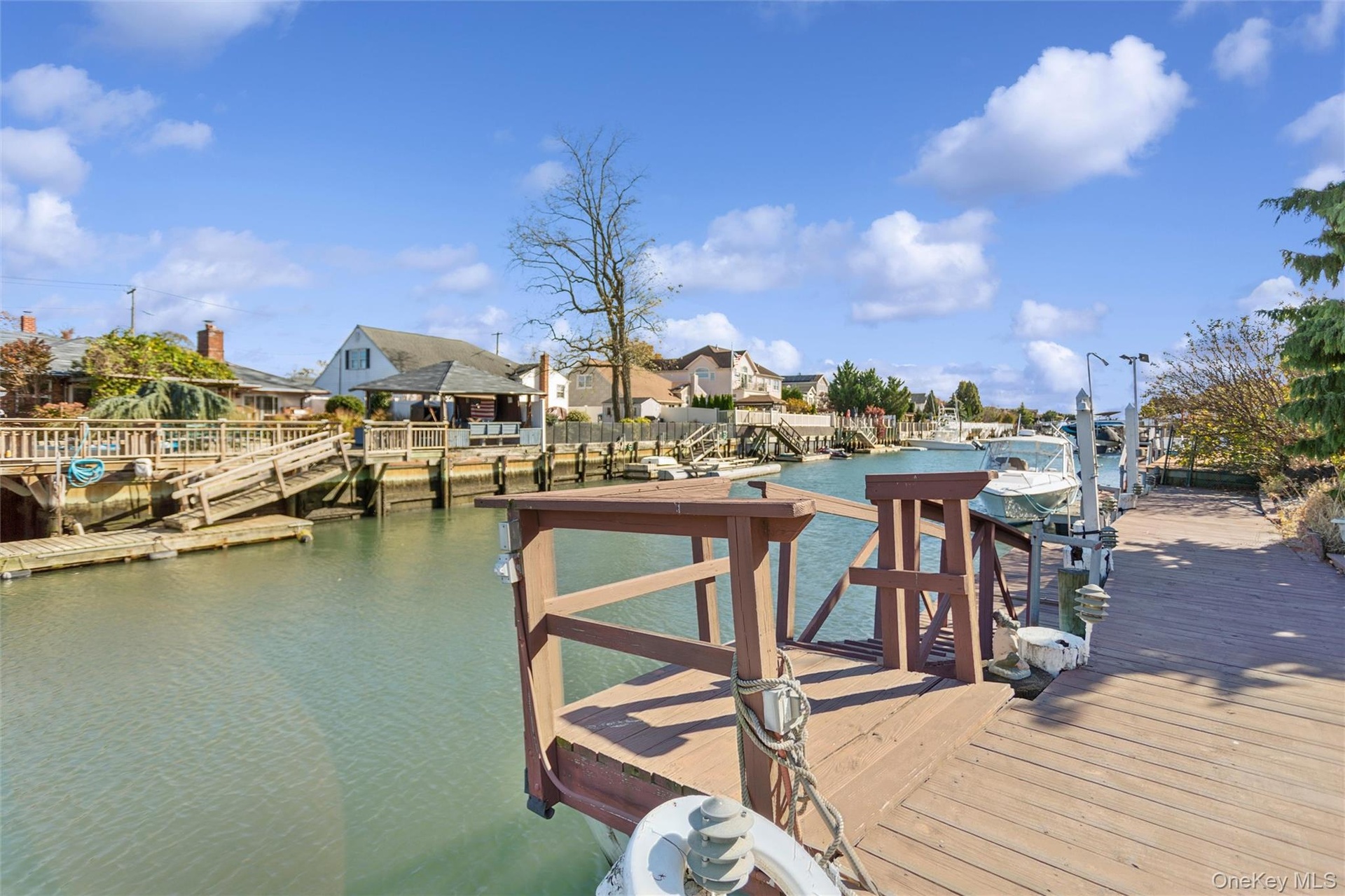 Dock area featuring a water view and a residential view